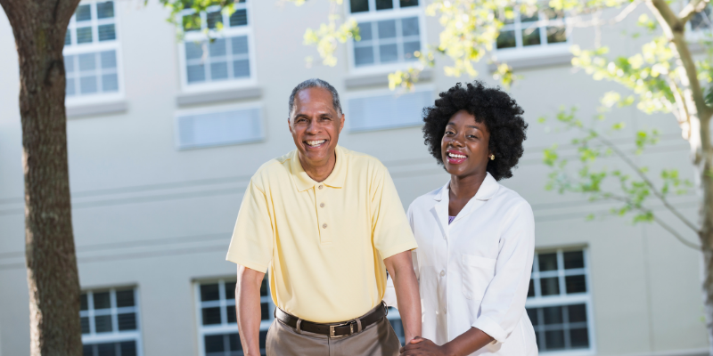 African american senior adult male with african american caregiver