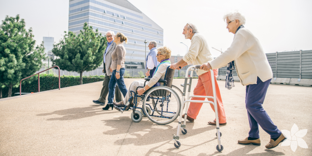 group of seniors walking outside in a city