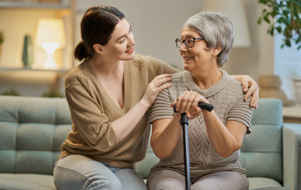 Younger woman and senior woman sitting together