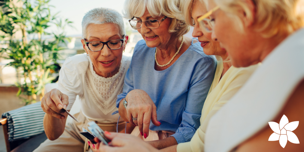 A group of senior women playing a card game together