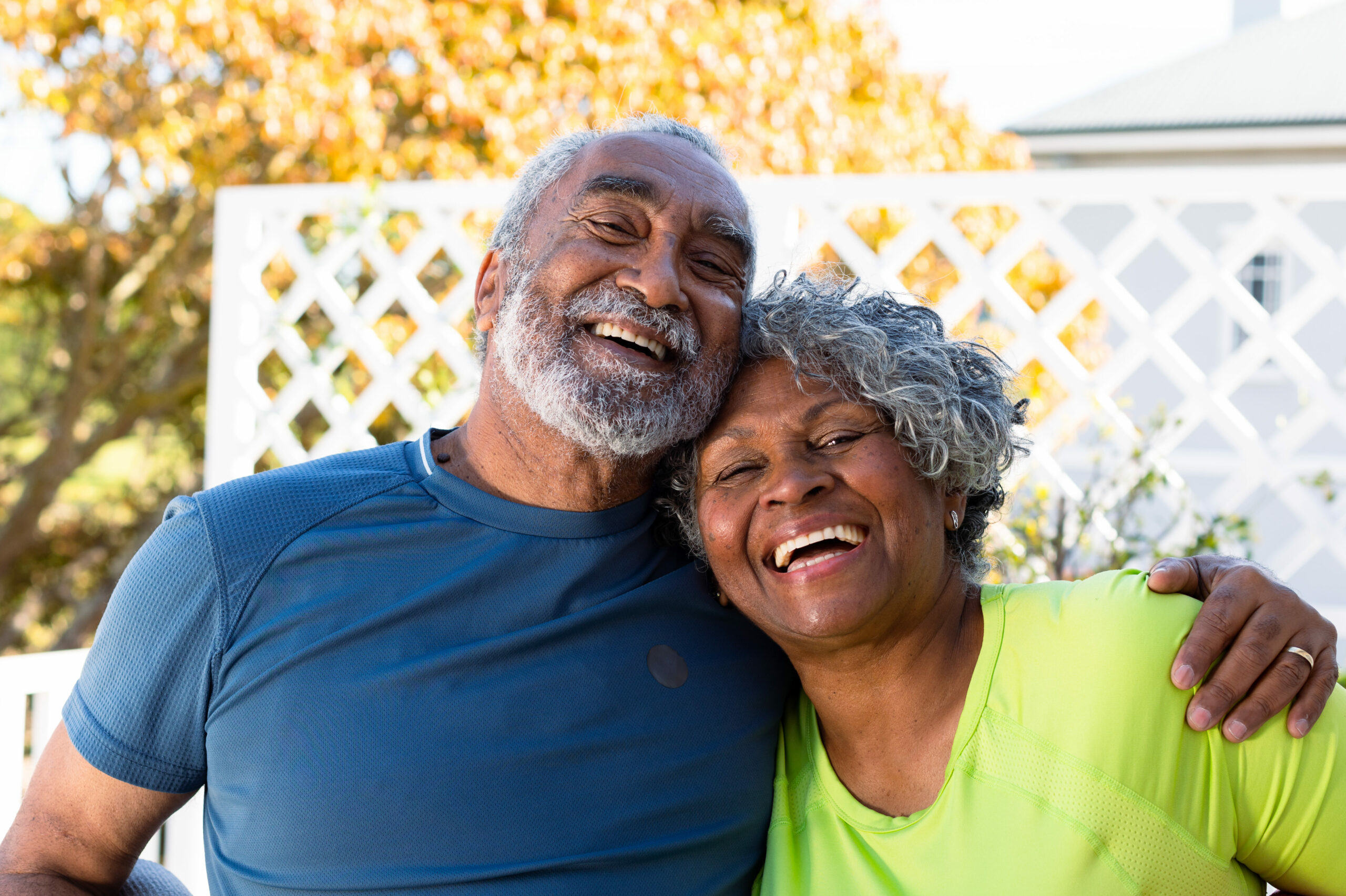 smiling African American couple holding each other