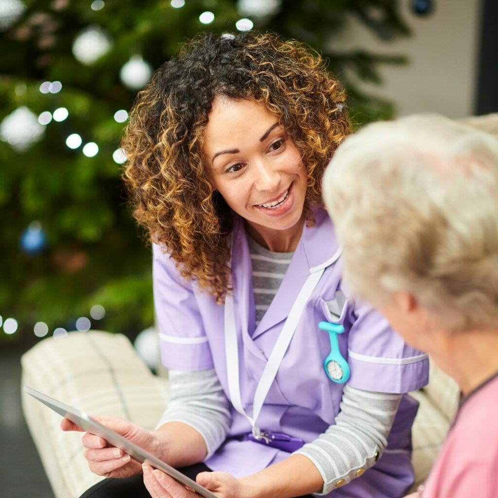 Nurse talking to senior woman