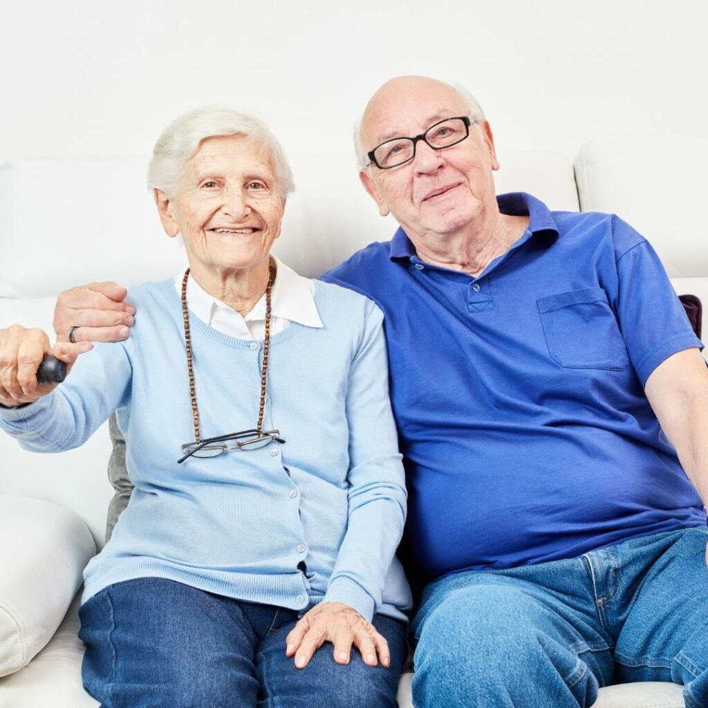 Senior couple sitting on a sofa together