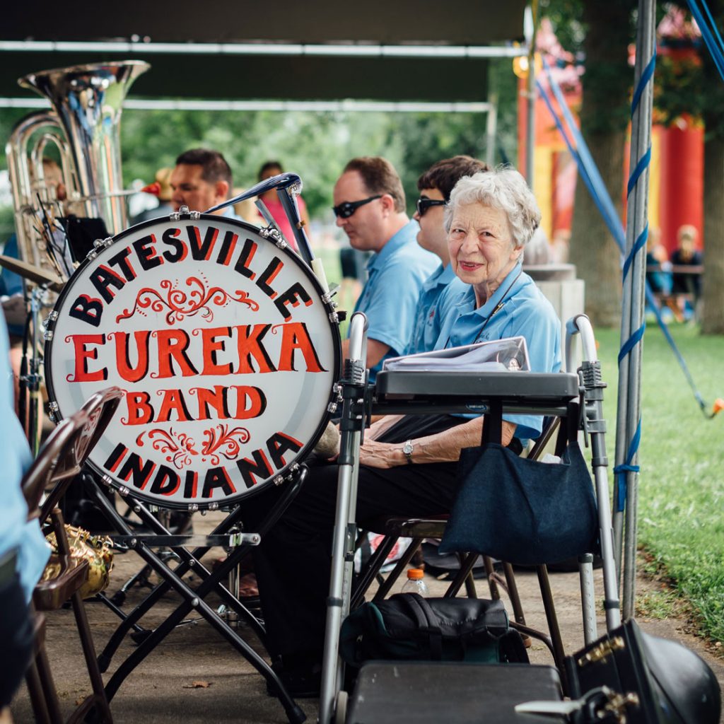 Senior woman sitting in a band