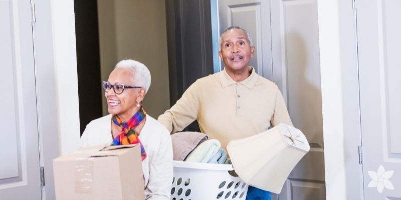 Senior couple moving boxes