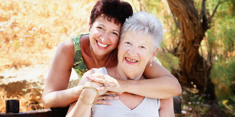 Senior woman and her daughter hugging